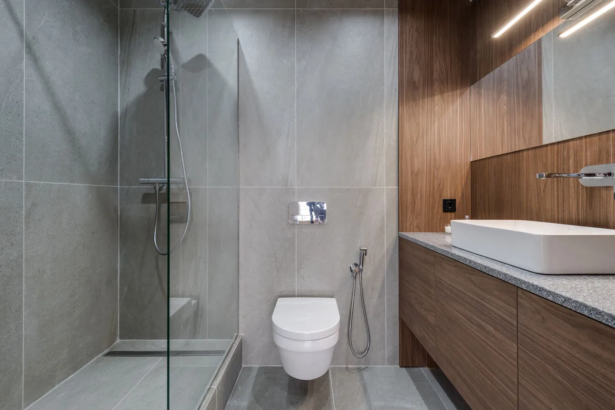 Modern bathroom with tiled flooring and a walk-in shower