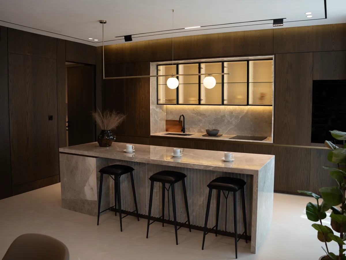 Modern kitchen design featuring marble island sleek with new countertops