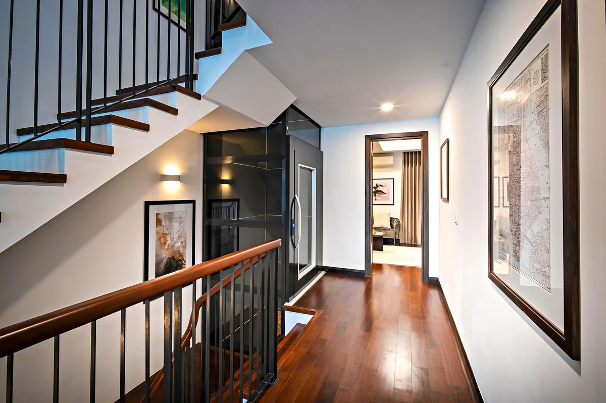 Sleek modern corridor staircase featuring wooden